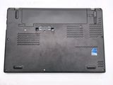 a close up of a laptop with a blue sticker on it