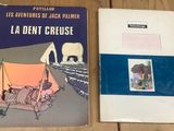 two books sitting on a table next to each other on a table