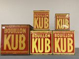 four boxes of bourbon kub sit on a shelf next to each other