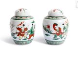two vases with birds on them on a white surface
