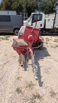 an image of a tractor and a trailer parked in a lot