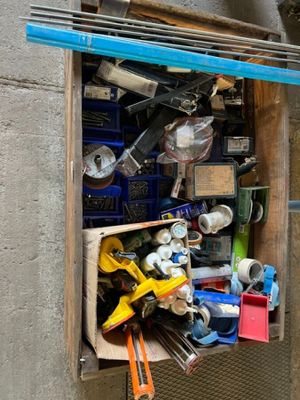 a wooden box filled with assorted tools and tools