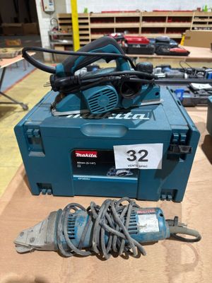 a blue box with tools on a table in a workshop