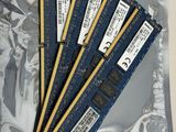 four memory modules are sitting on top of each other on a piece of foil