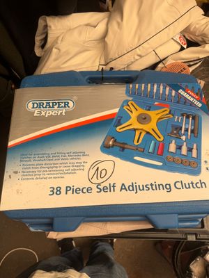 a box of tools sitting on top of a bed