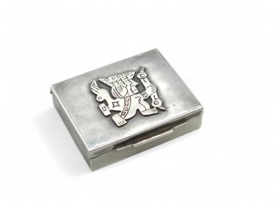 an image of a silver box with a coat of arms on it