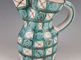 a blue and white pitcher sitting on a table