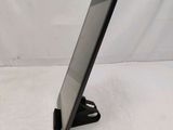 a close up of a tablet computer on a stand on a white surface