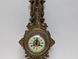 a clock hanging on the wall in the room