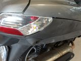 a close up of a motorcycle that is parked in a garage