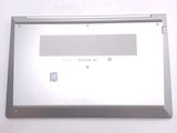 a silver laptop computer sitting on top of a white table