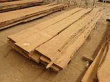 several pieces of wood are stacked on top of each other in a warehouse