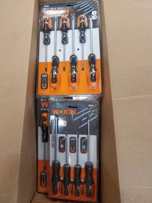 a box full of tools sitting on top of a cardboard box