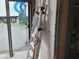 a ladder leaning against a wall next to a building