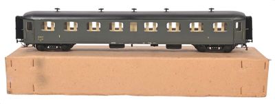 a black train car sitting on top of a cardboard box