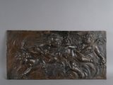 an image of a bronze plaque depicting a group of people on horseback