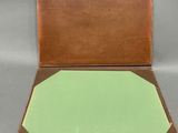an open box with a piece of paper in it sitting on a table