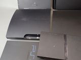 three different types of video game consoles sitting on a table