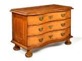 a wooden chest of drawers with brass hardware on it