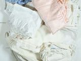 a pile of clothing that is on a white table