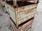 a rusted metal box with four drawers in it