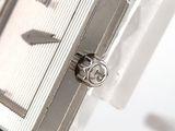 a close up of a watch on display on a stand