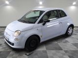 a picture of a small white car on a checkered floor