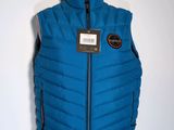 the vest is blue and has a black label on it