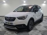 a picture of a white opel parked in a room