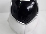 a silver and black helmet on a white surface