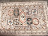rug on the floor with a lot of different colors and patterns