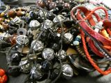 a pile of assorted bracelets on a table