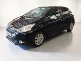 the small black car is parked in a white room