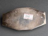 an image of a metal object with a sticker on it