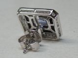 a pair of earrings that are sitting on a table