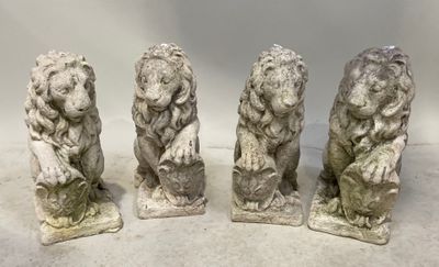 trois statues de lions en pierre sur fond blanc