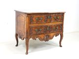 an image of a wooden chest of drawers with a marble top