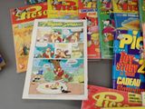a lot of comic books on the table