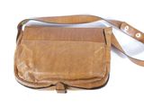 brown leather purse with strap on white background
