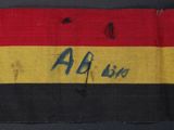 a close up of a red, yellow and black striped cloth