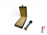 a small wooden box with a blue handle next to it