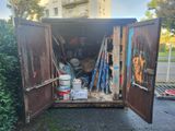a trash truck that has been left in the back yard