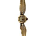 an image of a gold wrist watch with a metal band