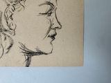 a drawing of a woman ' s face on a piece of paper