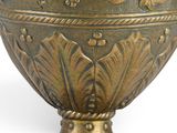 a large metal bowl with a decorative design on it