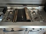 three burners on the stove in the kitchen