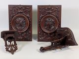 pair of antique carved wood bookends with a bird on the back