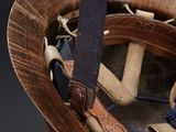 a baseball helmet with a baseball bat in it