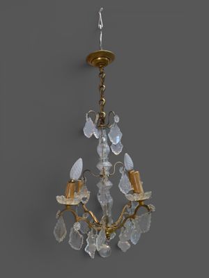 a close up of a chandelier hanging from a ceiling