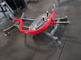 a gym area with a row of exercise equipment on the floor